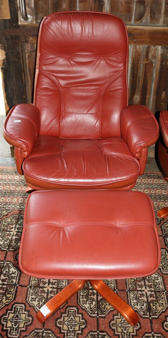 Mobel red leather upholstered swivelling and reclining armchairs and matching stool